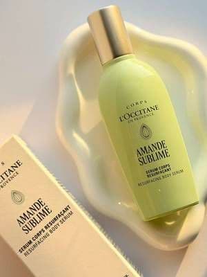 #gifted L’occitane Amande sublime : ALMOND RESURFACING BODY SERUM Formulated with 5% exfoliating AHA, Prickly Pear Extract and hydrating Hyaluronic Acid, the Resurfacing Body Serum,part is a powerhouse treatment designed to renew your skin's appearance. This serum is so advanced it targets six visible skin concerns, including strawberry skin, rough texture, skin marks, clogged pores, ingrown hairs, and fine dehydration lines. Its lightweight gel texture provides instant hydration, while maintaining the skin's natural barrier. I use this every night before sleeping and wake up with the softest skin I could ever dream for , visibly smoother, plumper, and more radiant skin . The scent of this serum is sweet, roasted almonds with cozy vanilla, grounded by fresh top notes of bergamot and a subtle, powdery undertone. The aroma is rich and creamy . @LOCCITANE @Butterly #loccitane #loccitaneamandesublime #thisisbutterly #skincare