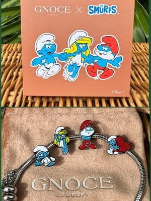 Once upon a time in Smurf Village… 💙 Papa Smurf and Smurfette’s eyes met for the first time, and love was born ❤️ The result? The sweetest baby Smurf charm - proof that even the tiniest stories can shine on your wrist! 🥰 @Gnoce Jewelry #Ad #gifted #GnoceJewelry #Smurfs #SmurfsBracelet